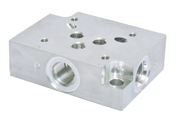 A silver block with holes and three different sizes.