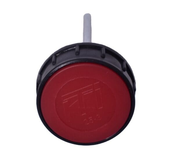 A red button with a black cap and white background