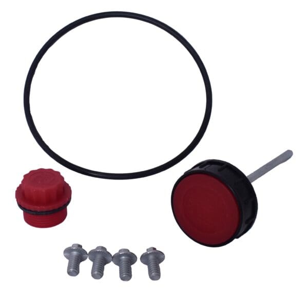 A red and black kit with some nuts, a gasket, and a cap.