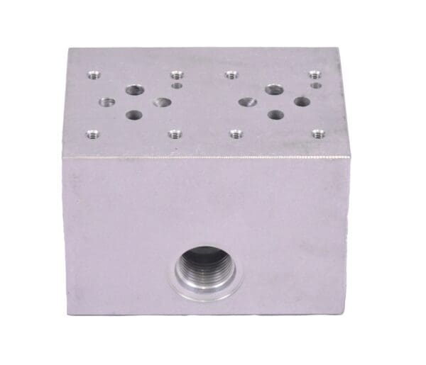 A block of metal with holes for the top.