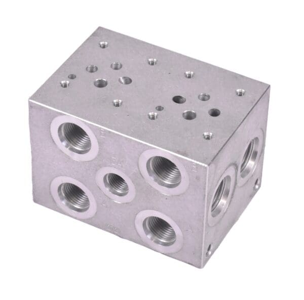 A block of metal with holes for the bottom.