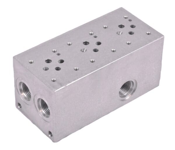 A silver block with holes on it