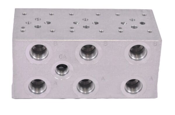 A block of metal with holes for the front and back.