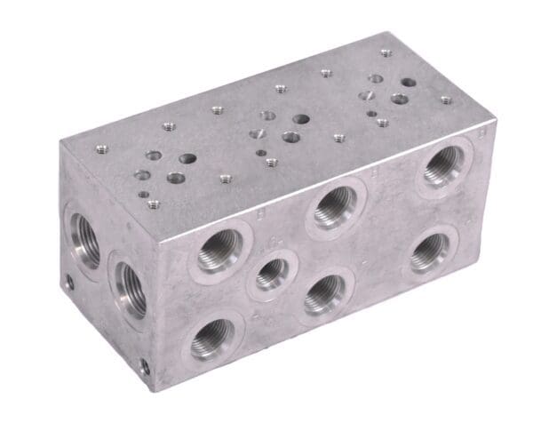 A block of metal with holes for the bottom.