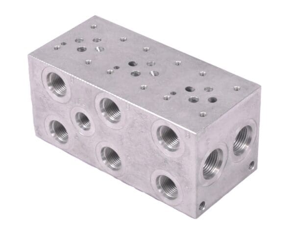 A block of metal with holes for the bottom.