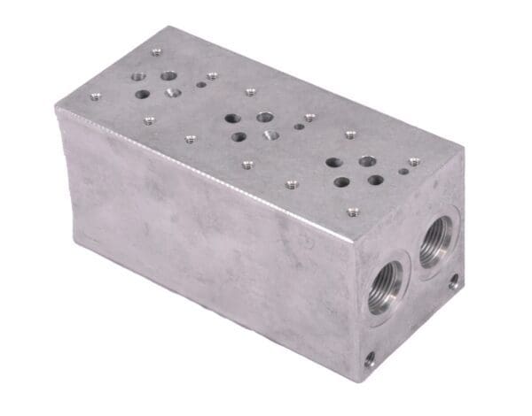 A silver block with holes on top of it.