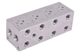 A block of metal with holes for the bottom.