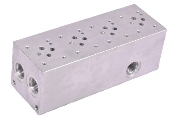 A silver block with holes on it