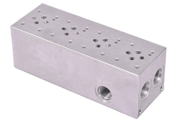 A silver block with holes on it