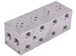 A block of metal with holes for the top.