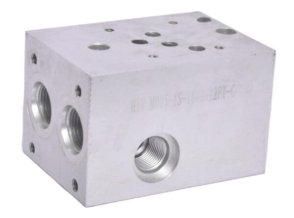 A block of metal with holes for the valves.