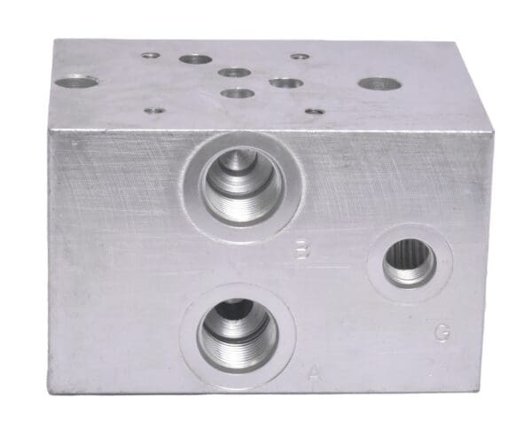 A block of metal with two holes for the valves.